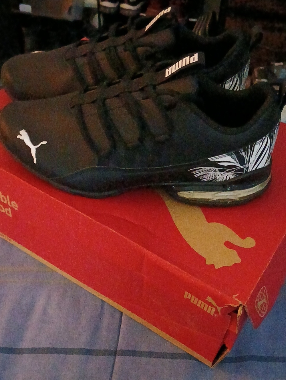 Puma Black Sneakers with White Logo and Leaf Accent